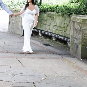 White lace shoulder/cape in the back.